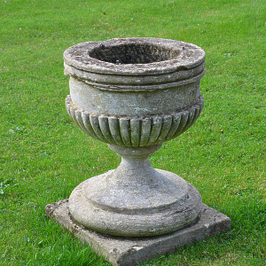 An 18th century carved stone urn 
