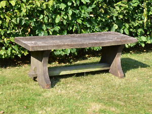 A rustic oak plank bench 