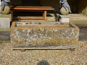 A large and beautifully patinated rectangular stone trough