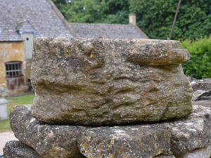 A medieval Ham stone gargoyle in the form of a lion or mythical beast