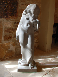 An elegant carved sandstone statue of a young Nubian woman