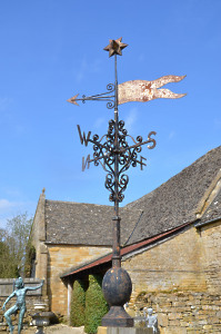 A wrought and cast iron weather vane
