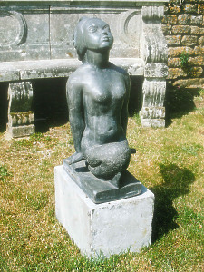 A fine stylised lead mermaid figure raised upon a marble plinth