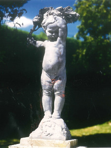 A beautiful early 20th century statue depicting a child holding aloft a laurel branch