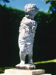 A charming 19th century lead statue of a child