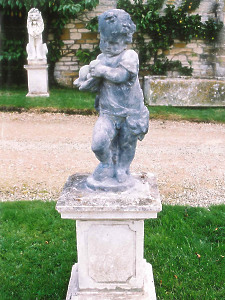 A late 17th/early 18th Century lead statue depicting Autumn, raised upon a later stone pedestal