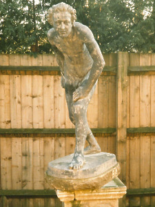 A 19th Century lead figure of a naked athlete leaning forward about to bowl