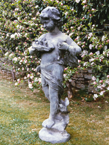 A charming 19th Century lead statue depicting a girl holding a bird's nest
