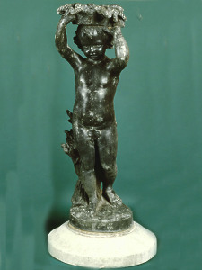 A charming 19th Century lead child figure depicting Summer mounted upon a stone base