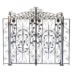 A pair of decorative wrought iron gates having leaf and flower motif throughout