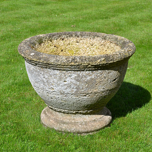 A circular stone planter