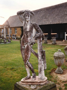 A 19th Century weathered composition stone statue depicting Adonis