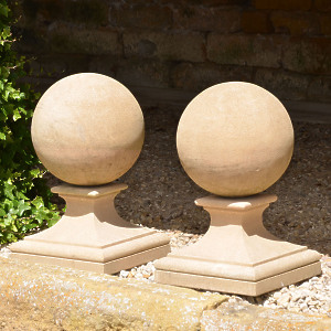 A pair of Bath stone ball finials 