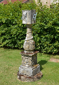 A Victorian carved stone multi-faceted sundial