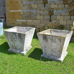 A pair of mid 20th century square stone planters of taper form 
