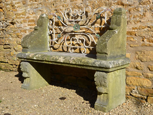 An early 20th century carved limestone garden seat