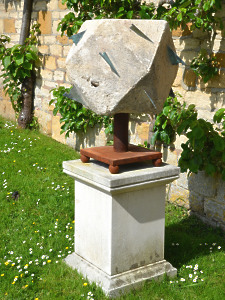 A large 18th century polyhedral limestone sundial