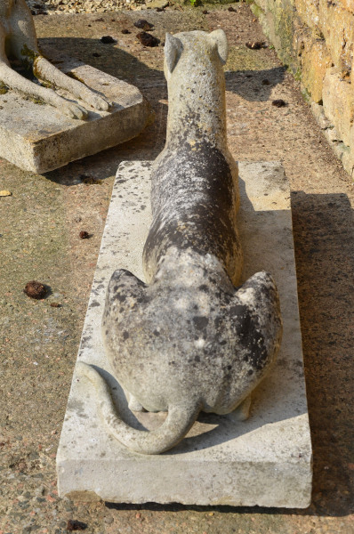 A large pair of composition stone reclining greyhounds by Austin and Seeley