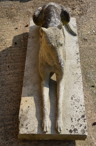 A large pair of composition stone reclining greyhounds by Austin and Seeley
