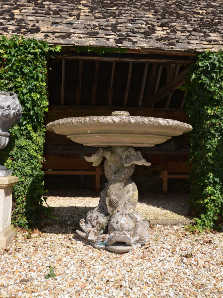 A composition stone fountain base by Austin and Seeley 