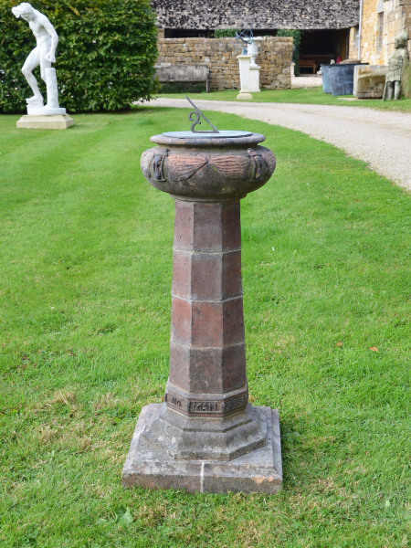 An Arts & Crafts terracotta sundial attributed to the Compton Pottery