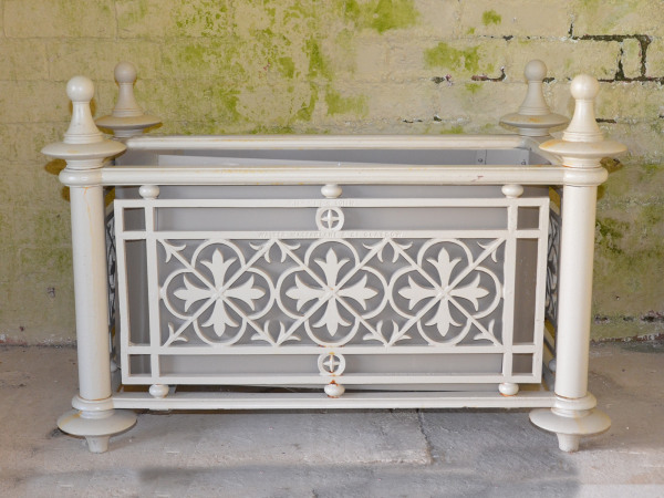 A pair of small cast iron Victorian planters