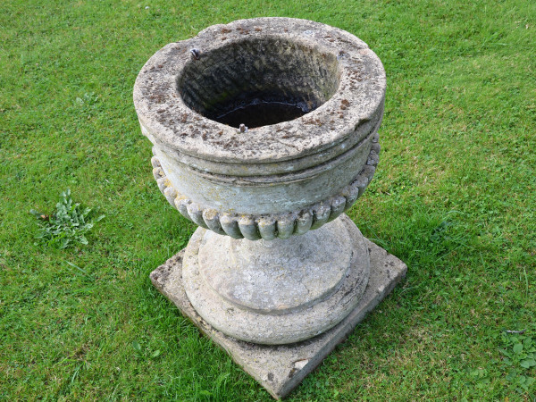 An 18th century carved stone urn 