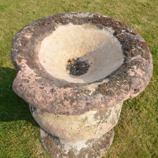 A large-scale single sand stone urn of bulbous form 