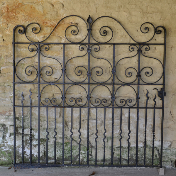 A large single wrought iron garden gate