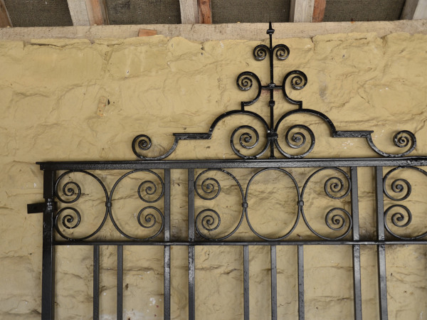 A large single wrought iron garden gate