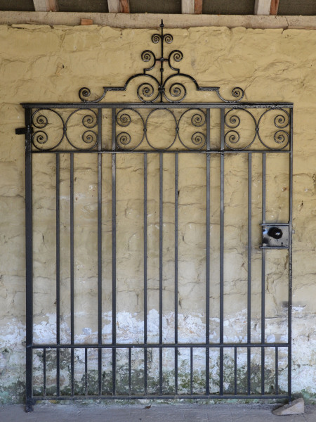 A large single wrought iron garden gate