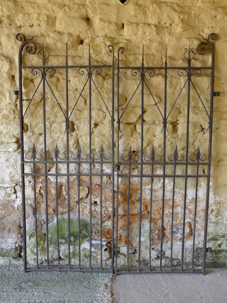 A pair of decorative wrought iron gates.