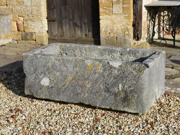 A large antique limestone trough with good weathering and patination