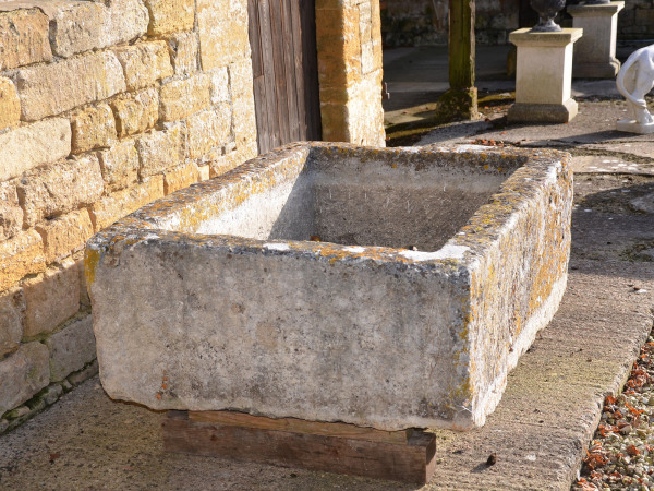 A large antique limestone trough with good weathering and patination