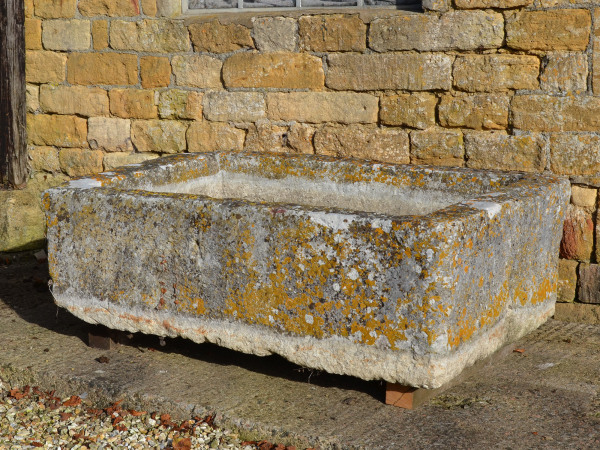 A large antique limestone trough with good weathering and patination