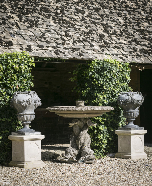 A fine pair of early 20th century lead garden urns