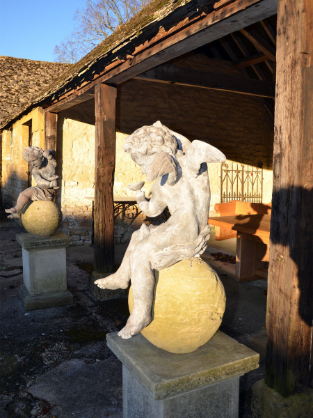 A pair of early 20th century lead Putti