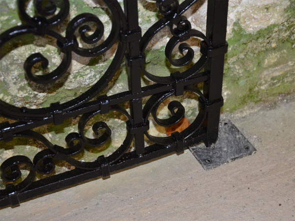 A pair of small early 20th century decorative wrought iron garden gates