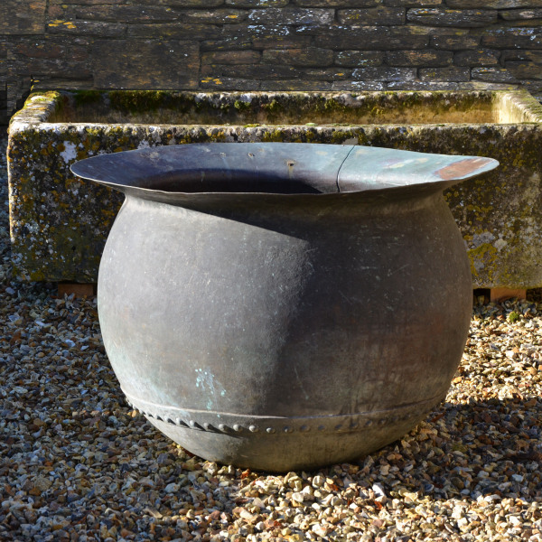 A first stage copper ‘tanners cauldron’ of bulbous form with wide flat rim