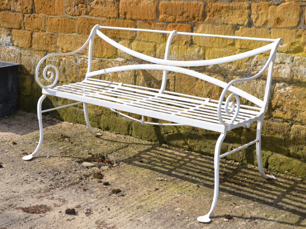 A 19th century wrought iron garden bench