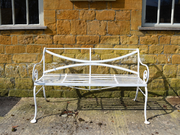 A 19th century wrought iron garden bench