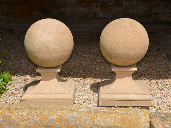 A pair of Bath stone ball finials 