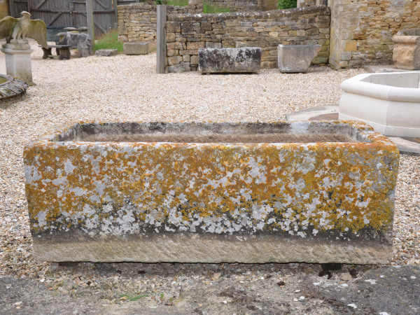 A large and beautifully patinated rectangular stone trough