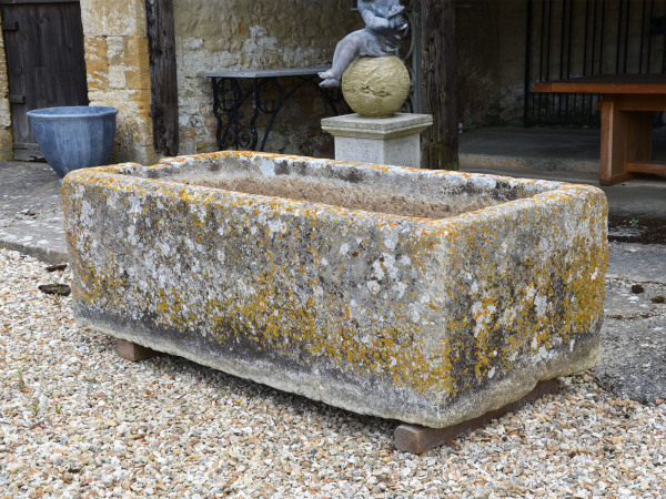 A large and beautifully patinated rectangular stone trough