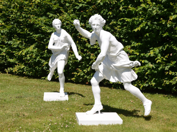 A pair of painted zinc statues of Hippomenes and Atalanta