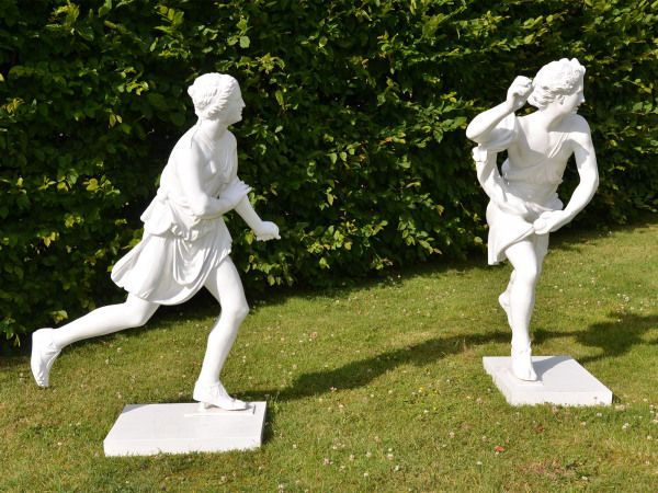 A pair of painted zinc statues of Hippomenes and Atalanta