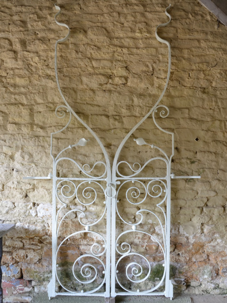 A pair of extraordinary early 20th century wrought iron garden gates