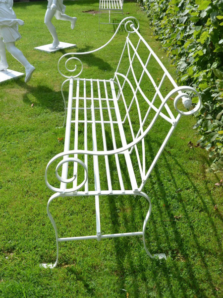 A 19th century wrought iron strap work garden seat having cabriole legs and scroll arms