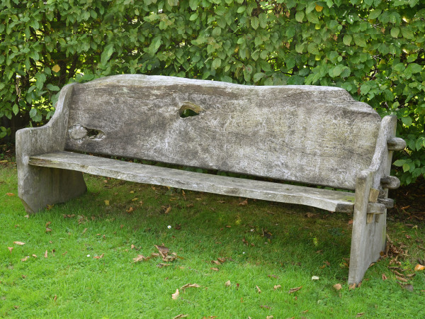 A long rustic elm plank seat