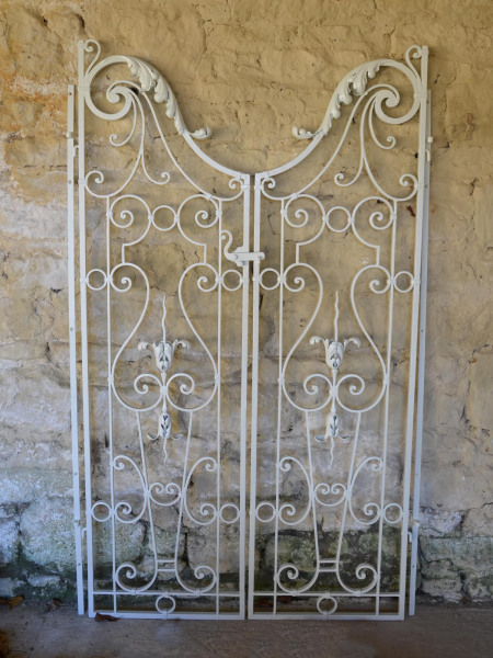 A pair of wrought iron garden gates in the Rococo taste